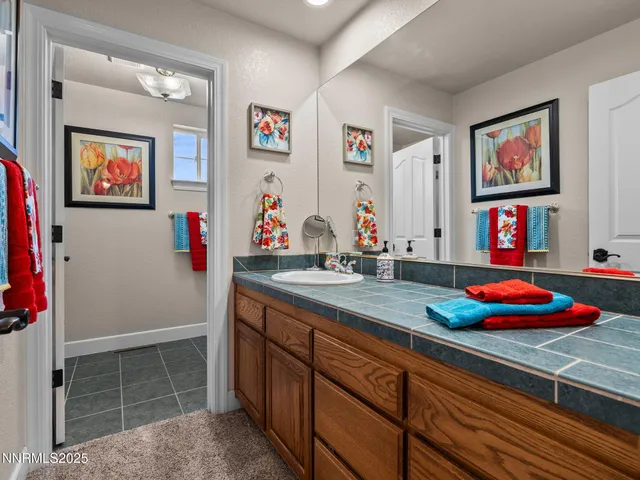 a kitchen with stainless steel appliances a sink dishwasher stove and cabinets