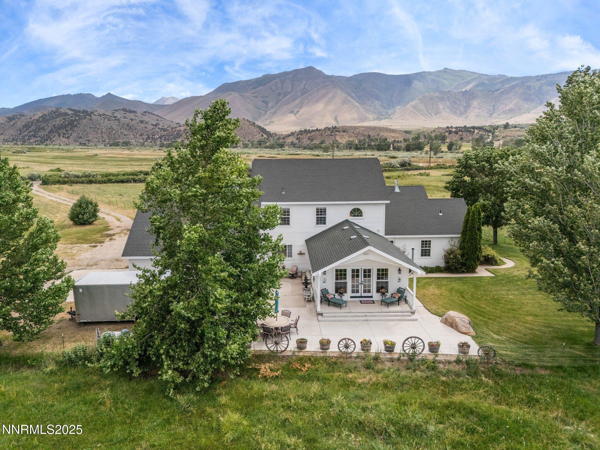 801 Larson Lane Coleville, CA 96107 - Photo 34 of 37 a view of a house with a garden and a mountain view