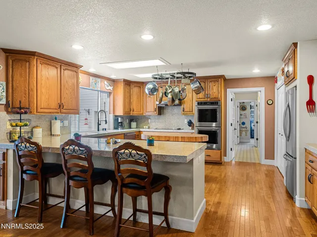 a view of a dining room and kitchen with furniture and a kitchen
