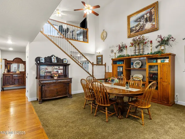 a living room with furniture or couch and a ceiling fan