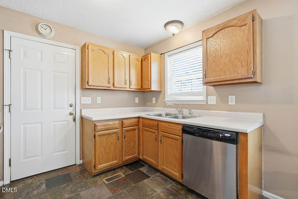 1560 Cane Mill Road Coats, NC 27521 - Photo 15 of 32 a kitchen with a sink cabinets and window