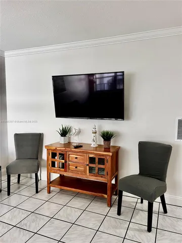 a room with furniture and a flat screen tv