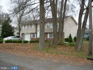 39 Fordham Road Pennsville, NJ 08070 - Photo 2 of 6 a view of a brick house next to a road and trees