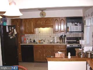 39 Fordham Road Pennsville, NJ 08070 - Photo 4 of 6 a kitchen with stainless steel appliances granite countertop a sink and cabinets