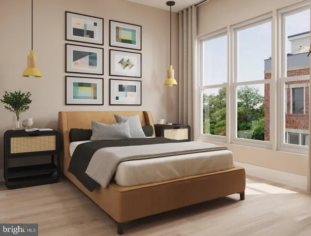 a bed room with a bed and a chair