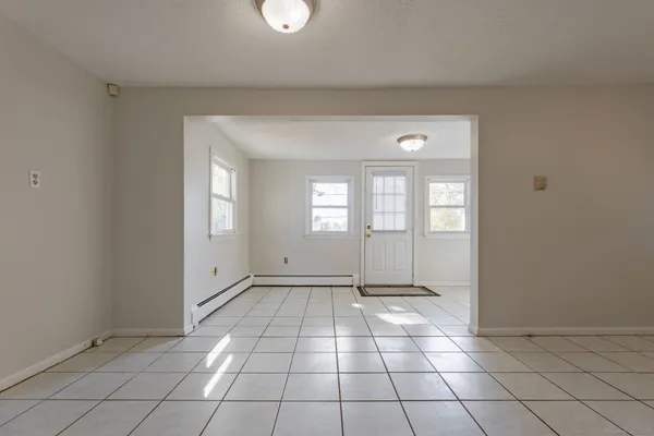 a view of an empty room and window