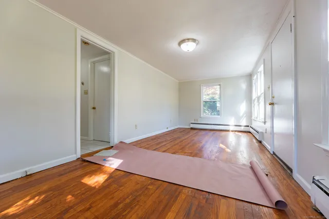 a view of an empty room and window