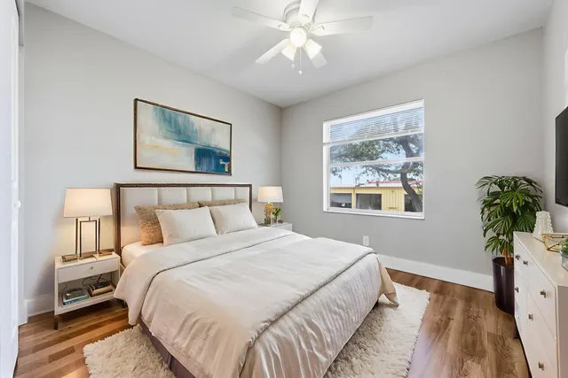 a bedroom with bed and a window