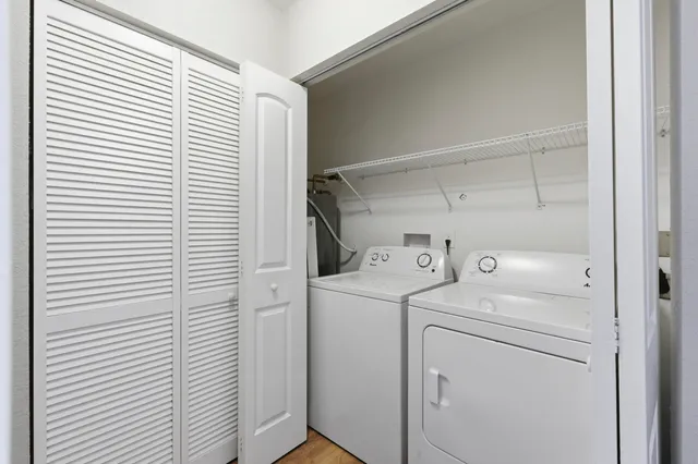 a view of storage and utility room with washer and dryer