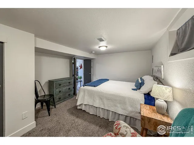 a bedroom with furniture and a bed