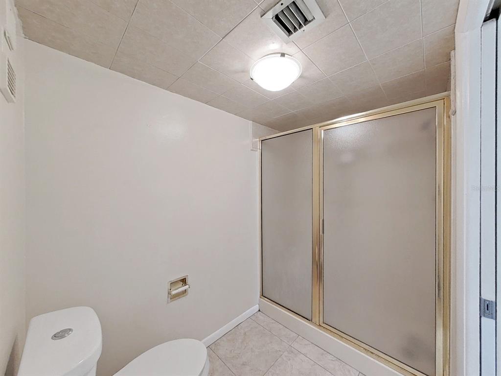 700 Starkey Road, Unit 624 Largo, FL 33771 - Photo 17 of 24 a bathroom with a shower a toilet and a sink