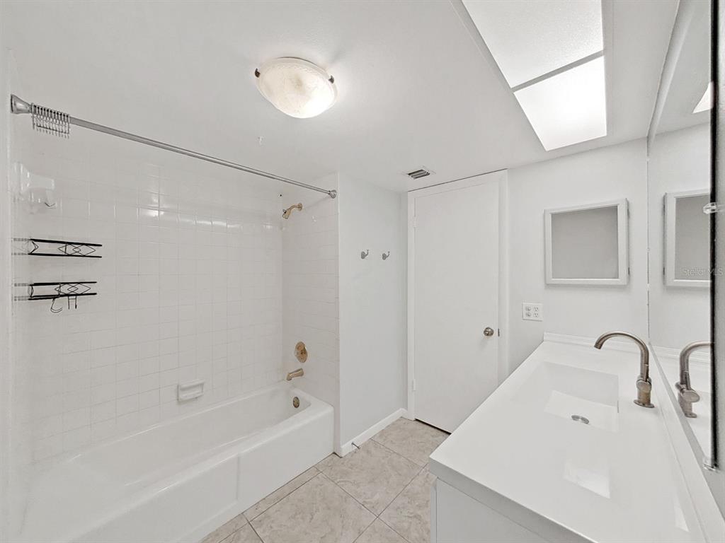 700 Starkey Road, Unit 624 Largo, FL 33771 - Photo 20 of 24 a bathroom with a bathtub and shower