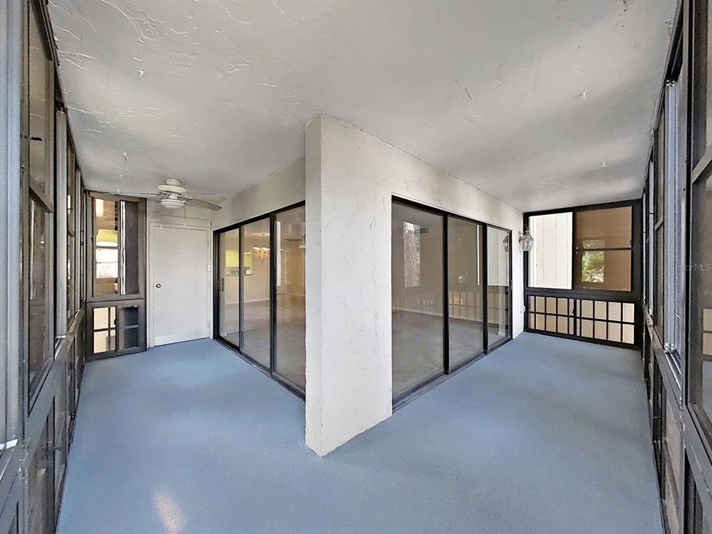 700 Starkey Road, Unit 624 Largo, FL 33771 - Photo 22 of 24 a view of an empty room with window and stairs