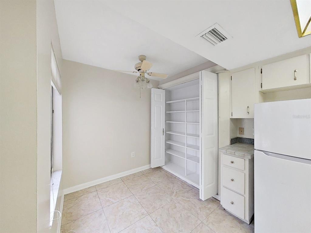 700 Starkey Road, Unit 624 Largo, FL 33771 - Photo 10 of 24 a view of an empty room with a kitchen