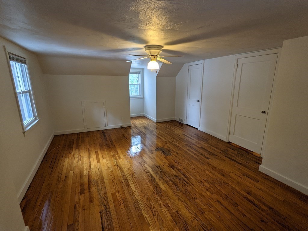 620 Alden Street Springfield, MA 01109 - Photo 2 of 11 wooden floor in an empty room with a window