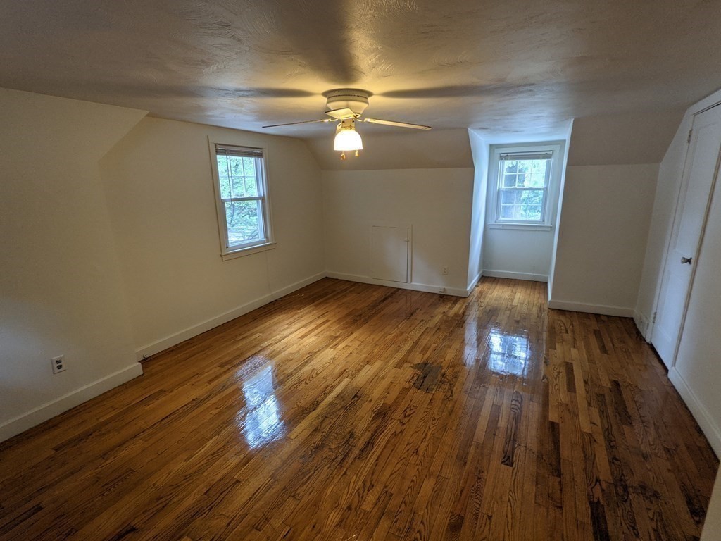 620 Alden Street Springfield, MA 01109 - Photo 3 of 11 wooden floor in an empty room with a window