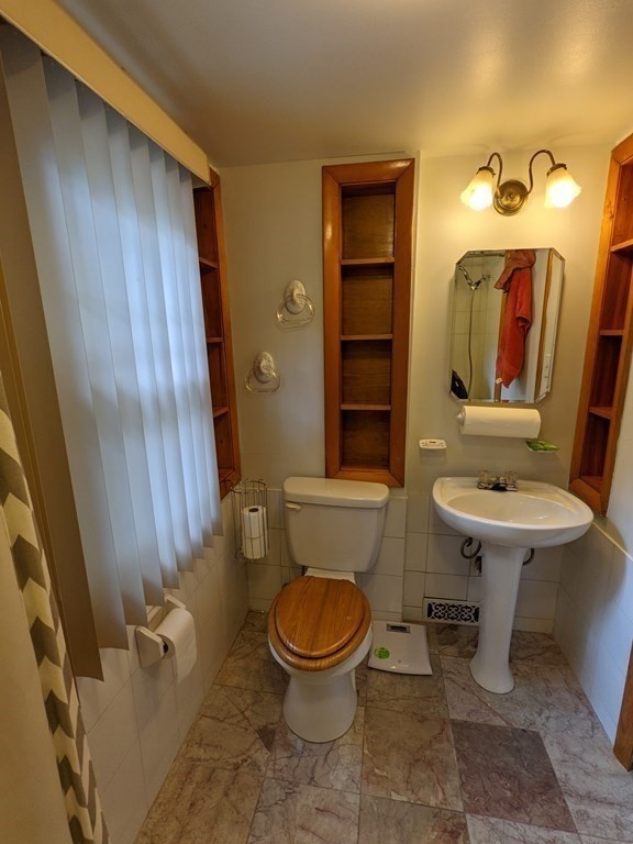 620 Alden Street Springfield, MA 01109 - Photo 8 of 11 a bathroom with a sink toilet and mirror