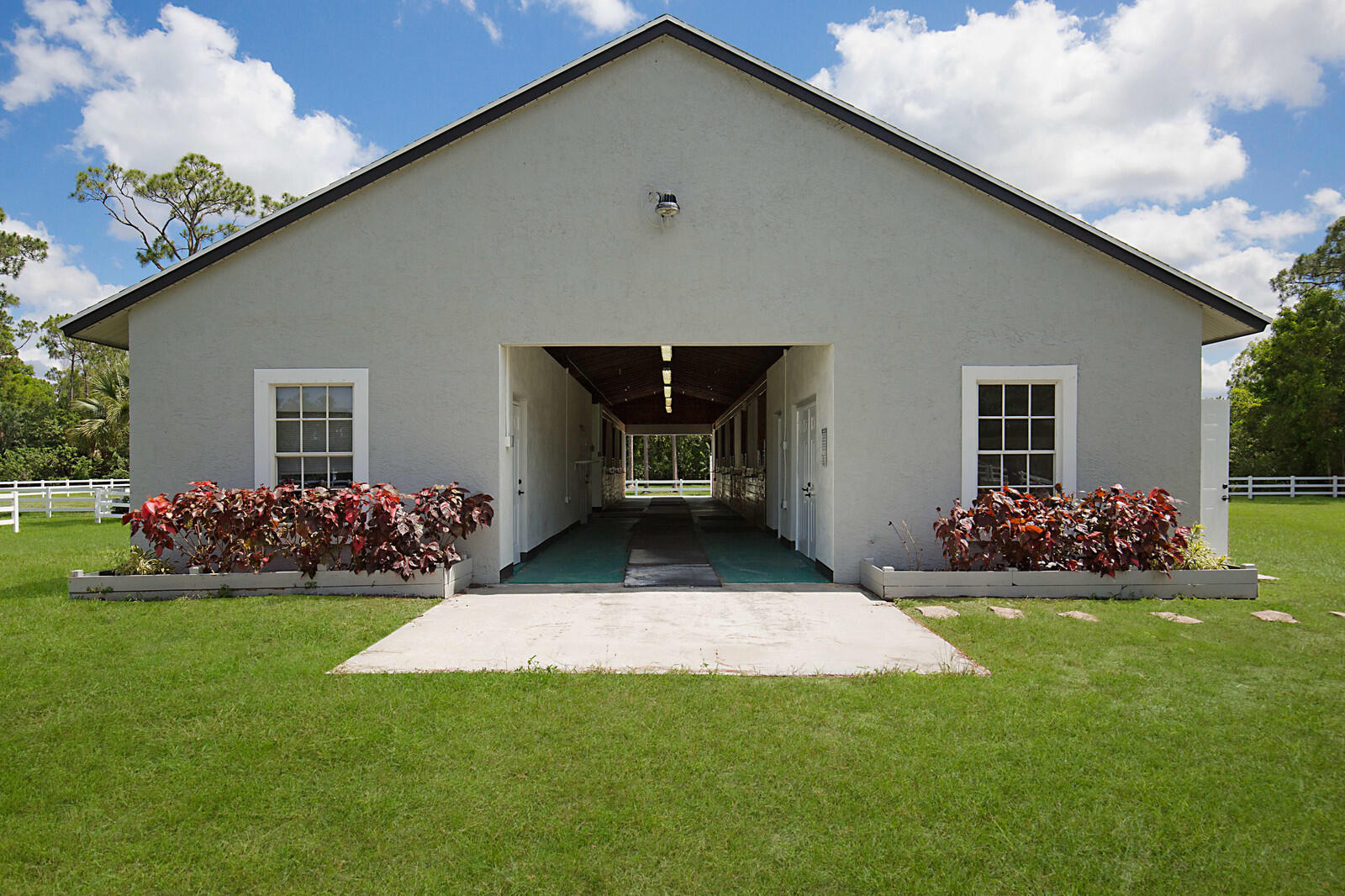 13346 Casey Road Loxahatchee, FL 33470 - Photo 39 of 53 8 stall center aisle CBS barn