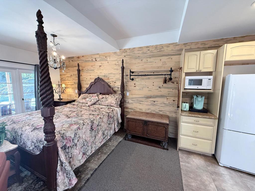 22292 Crestline Road Palomar Mountain, CA 92060 - Photo 27 of 38 a bedroom with bed and window
