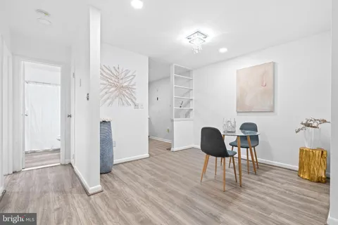 a workspace with furniture and wooden floor