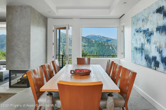a view of a dining room with furniture window and outside view