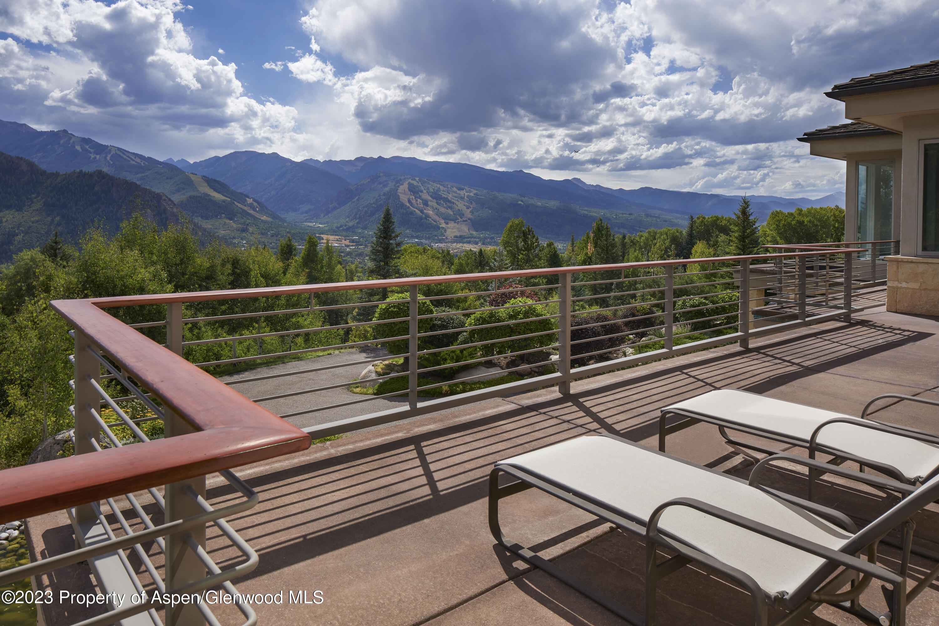 804 Hunter Creek Road Aspen, CO 81611 - Photo 22 of 31 a view of a balcony with two chairs