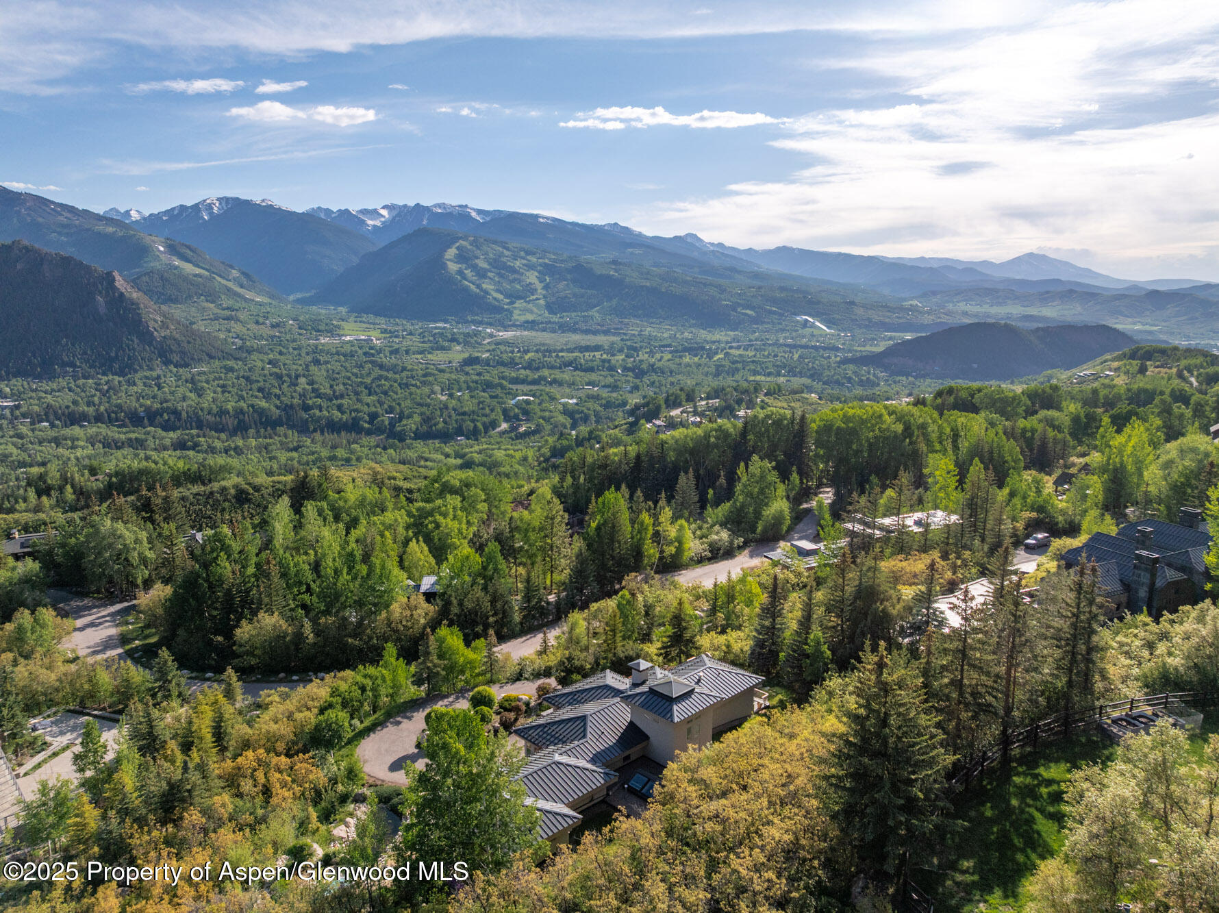 804 Hunter Creek Road Aspen, CO 81611 - Photo 31 of 31 a view of a lush green hillside and houses