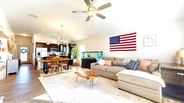 a living room with furniture gym equipment and a window