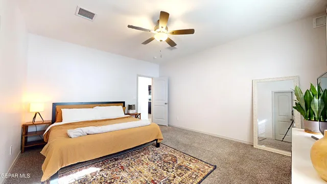 a view of an house with backyard porch and a garden