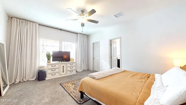 a view of a house with backyard porch and sitting area