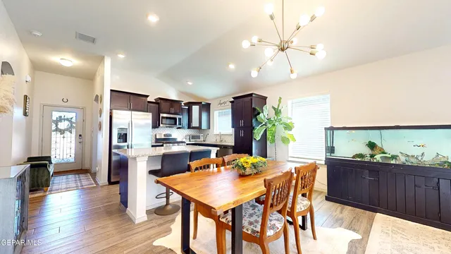 a bedroom with a bed and a potted plant