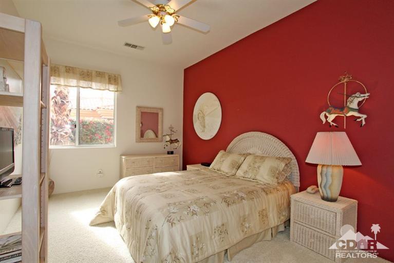 178 Loch Lomond Road Rancho Mirage, CA 92270 - Photo 22 of 32 a bedroom with bed and a window