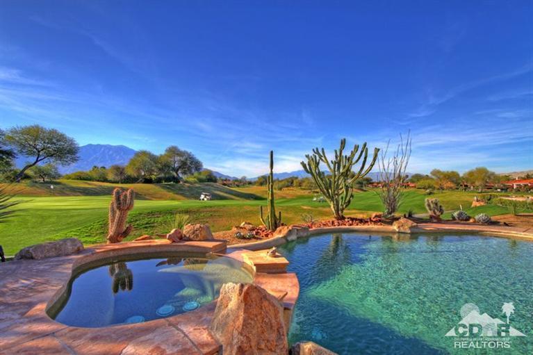 178 Loch Lomond Road Rancho Mirage, CA 92270 - Photo 4 of 32 a view of a swimming pool and lounge chairs