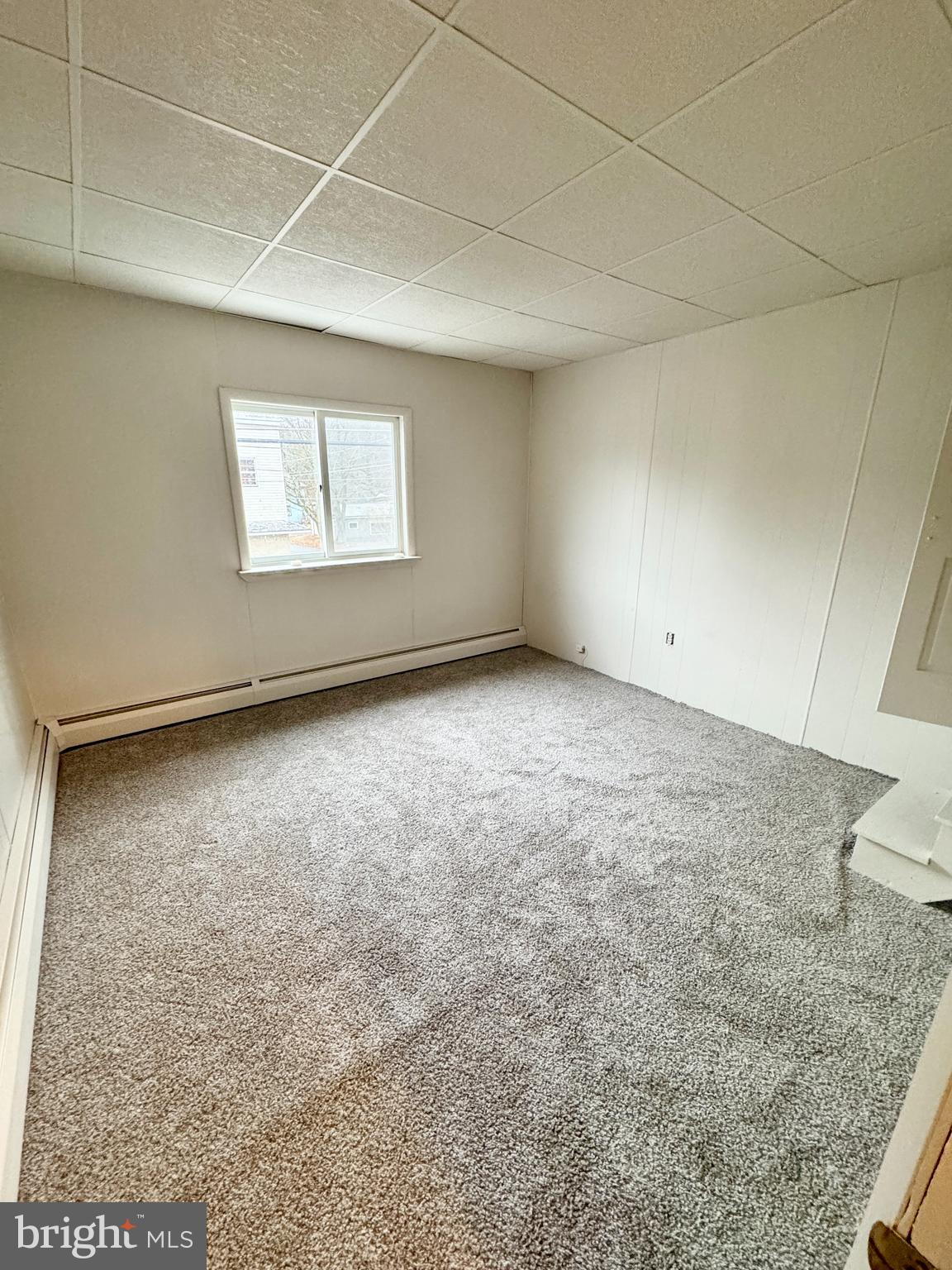 709 Summit Hill Road Ashland, PA 17921 - Photo 2 of 19 an empty room with a empty space and windows