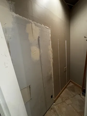 a bathroom with a shower and a sink