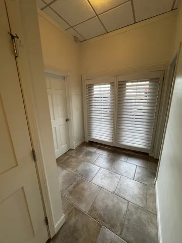 a view of an empty room with a window