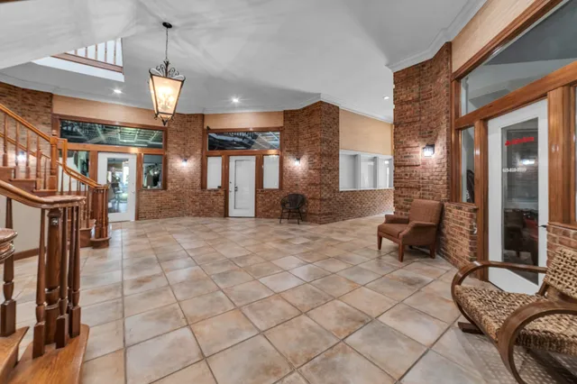 a front view of a house with a yard and a street view