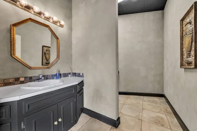 a bathroom with a toilet and a mirror