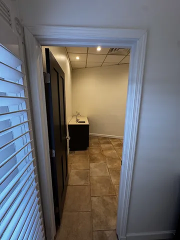 a view of entryway with a wooden door