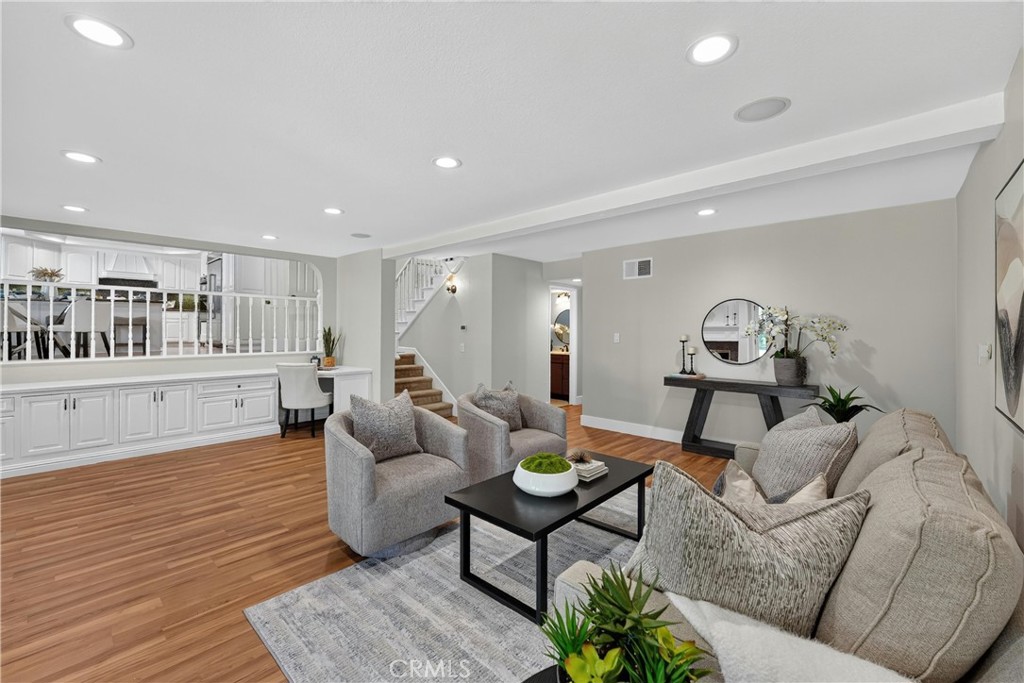 2935 Bluebell Avenue Brea, CA 92821 - Photo 14 of 38 Spacious family room featuring a cozy fireplace and seamless access to the backyard
