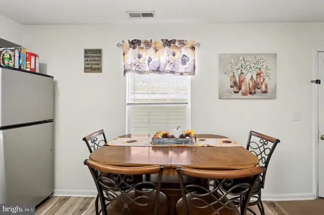 a view of a dining room with furniture