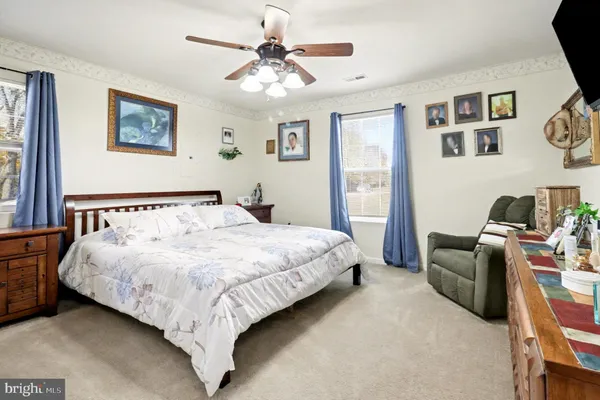 a bedroom with bed and furniture