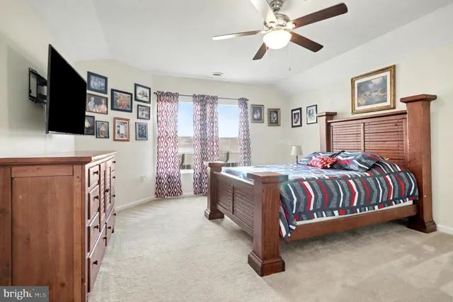 a bed room with a bed and a flat screen tv