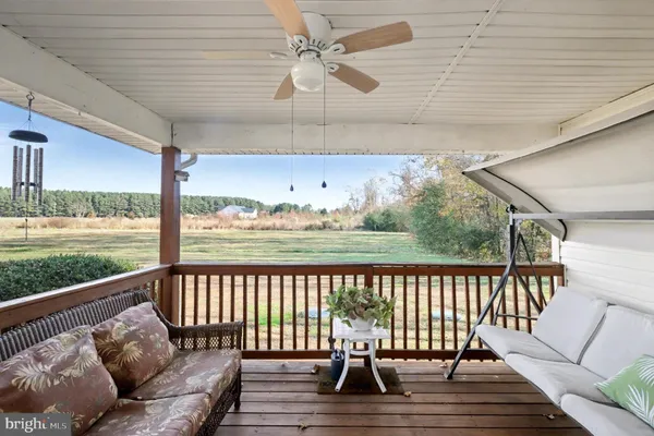 a view of balcony with furniture