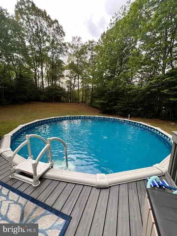 a view of a swimming pool with a lounge chairs