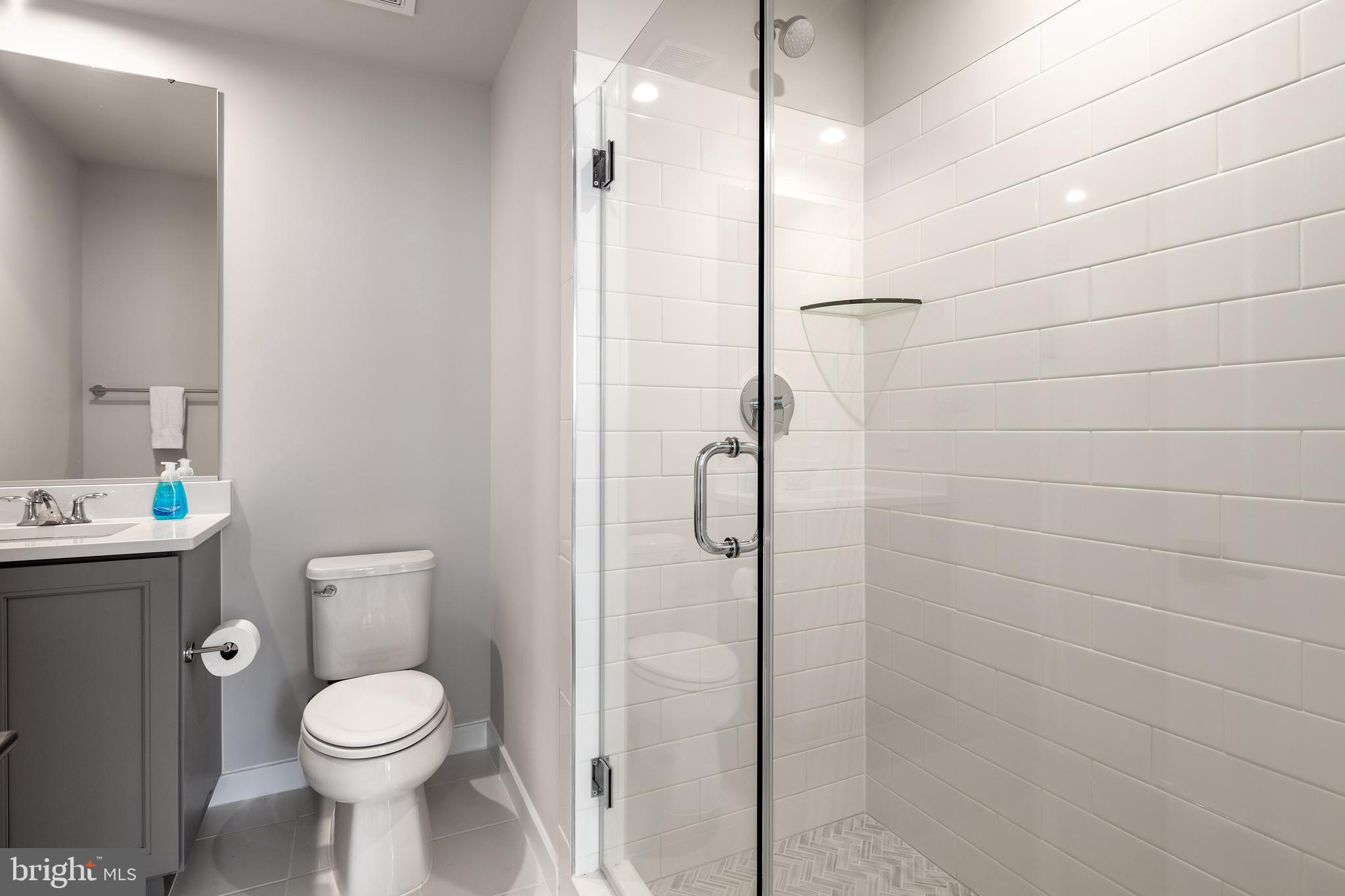 1770 Violet Ridge Place McLean, VA 22102 - Photo 9 of 54 a bathroom with a toilet sink and shower