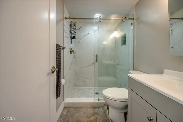 a view of bathroom with washer and dryer