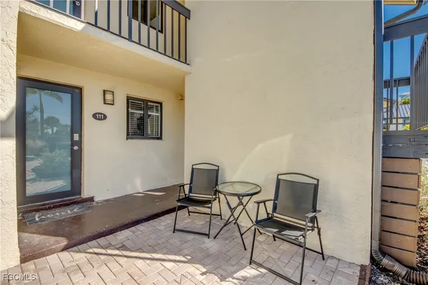 a view of a hallway with seating area