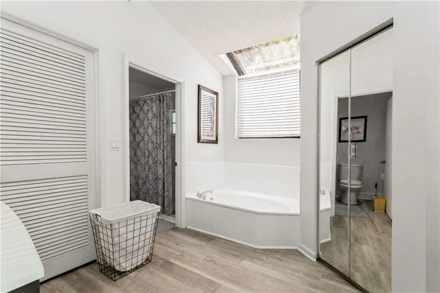 a bathroom with a bathtub and a shower