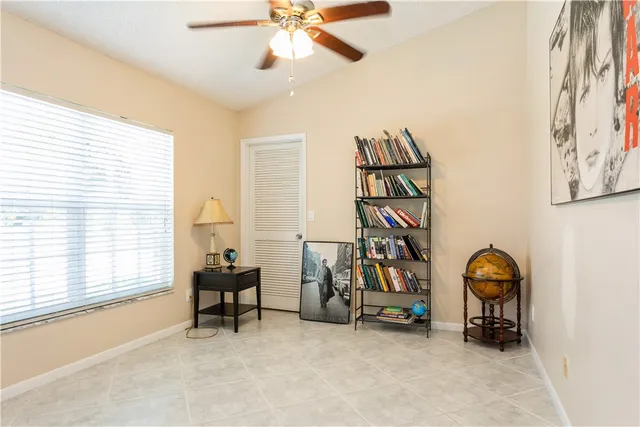 a view of a livingroom with furniture and a ceiling fan